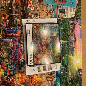 Buffalo Games 2000 piece Family Campsite jigsaw puzzle.